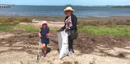 Adult and child on a clean up activity