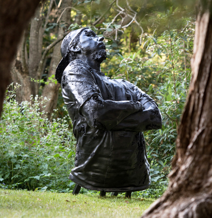 Louis Pratt's sculpture 'King Coal' featuring the head and torso of a man wearing a cap backwards with his arms crossed